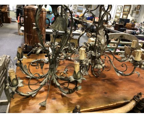 A modern Italian painted metal six light chandelier, with "candle" electric fitments, 70cm drop; a five light chandelier; and