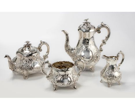 Comprising: a teapot, coffee pot, milk jug and sugar basin, the coffee and teapot with floral embossed hinged cover, surmount