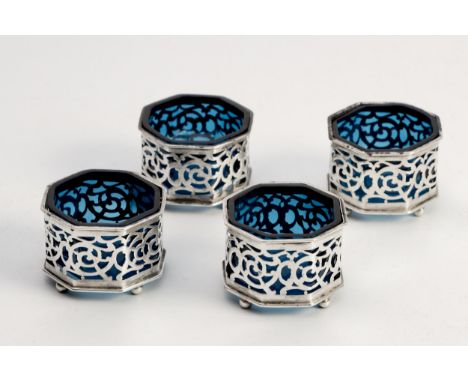 Octagonal, each body pierced, raised on four bun feet, with blue plastic liners4,5cm wide, 80g weighable silver(4)