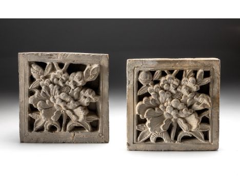 Each square tile moulded and carved with a large tree peony in full bloom enclosed by leaves within a plain border, minor cra