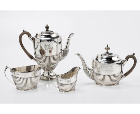 Comprising: a coffee pot, tea pot, sugar basin and milk jug, the coffee pot with gadrooned hinged cover, ebonised finial and 