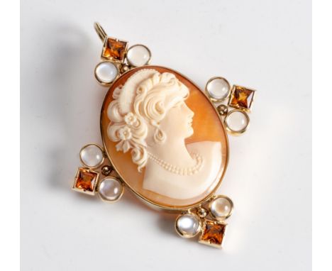 Centred with an oval shell cameo carved with the portrait of a lady, embellished to the cardinal points with moonstone caboch