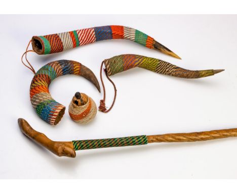 Long staff, head carved in the curve of the handle and four snuff containers (three horns and one small calabash), all covere