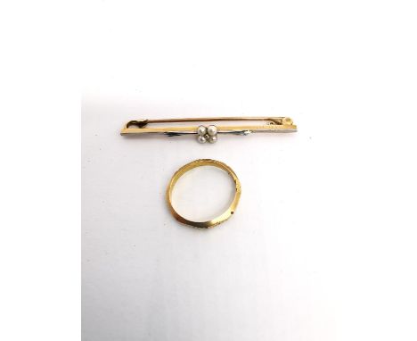 A 15ct rose and white gold and pearl floral bar brooch along with a Victorian 18ct sectioned and floral engraved wedding band