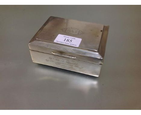 A George V silver cigarette box, Birmingham 1933, the cover with engine-turned decoration centred by an engraved monogram wit