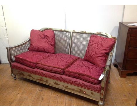 A 1920's silver lacquer Chinoiserie bergere sofa, probably Hille of London, the twin panel canework back continuing to downsc