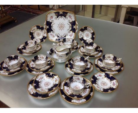 A 19th century Coalport  tea service,  comprising eight teacups, twelve saucers, nine side plates, cream jug and slop bowl an