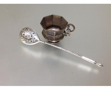 A Russian silver small cup, bearing Moscow 84 Zolotnik mark for 1860, of octagonal baluster form, with double scroll handle; 