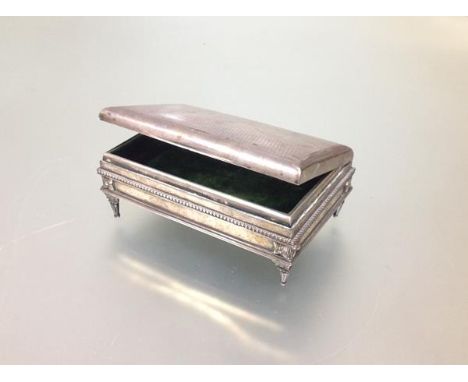 An Edwardian silver jewellery casket, Mappin &amp; Webb, London 1904, of rectangular form, the hinged cover with engine-turne