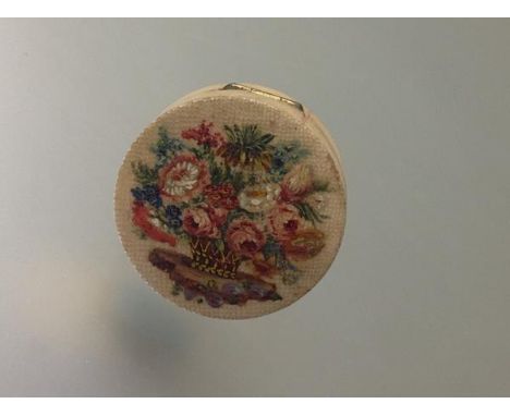 A  shagreen patch box, possibly French, circular, the hinged cover polychrome painted with a basket of flowers, the gilt-meta