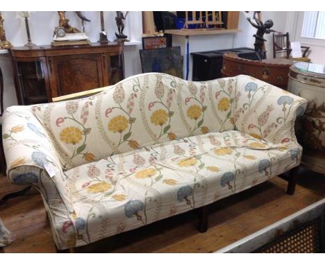 A George III mahogany framed camel back sofa, c. 1800, of characteristic form, the stuffed over seat between outscrolled arms