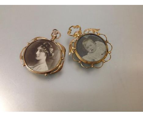 Two late 19th century yellow metal double-sided open pendant lockets, each with glazed circular compartment enclosing a portr