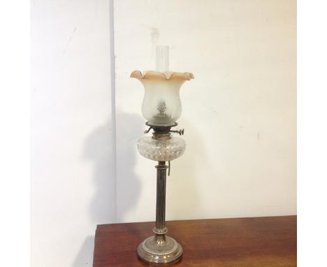 An Edwardian silver-plated columnar oil lamp, Collis &amp; Co., the fluted column raised on a stepped circular base, beneath 