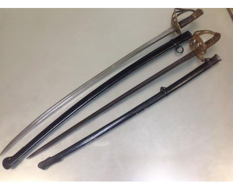 A French 1822 pattern trooper's cavalry sabre, 1874, Chatellerault mark to the blade, in a black-painted scabbard; together w