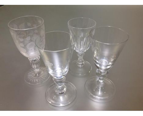 A group of 19th century and later baluster stem drinking glasses comprising: a rummer with bucket bowl on a knopped, faceted 