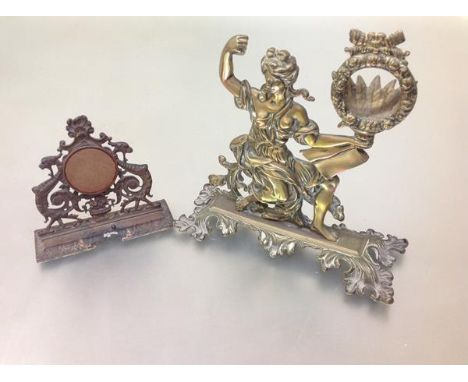 A 19th century brass watch stand, modelled as a female Classical figure holding a bound wreath forming the aperture for the p
