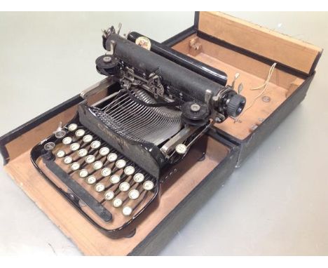 A travelling cased folding Corona typewriter no. 3. Case 12cm by 28cm by 24.5cm