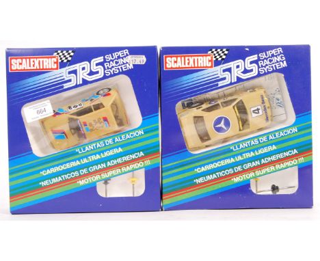Two original vintage Scalextric SRS Super Racing System 1/32 scale slot car racing models comprising: C017 Peugeot 205 Turbo 
