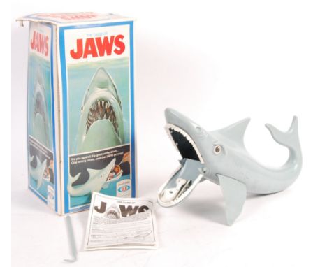 An original vintage Ideal made ' The Game Of Jaws ' movie tie-in boxed game. Appears complete, including the smaller accessor