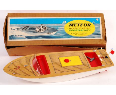 An original vintage Sutcliffe mechanical model Meteor Clockwork Driven Speedboat. Plastic and wood construction. Appears in g