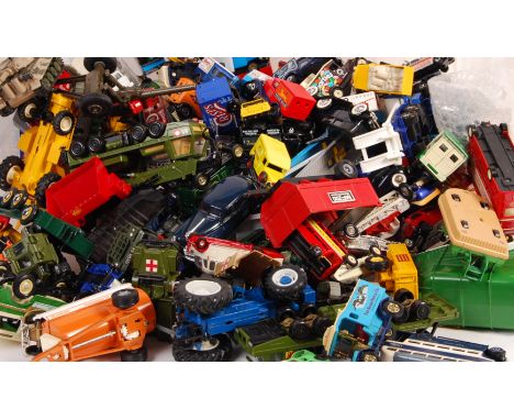 A collection of approximately 100+ assorted scale diecast model vehicles by Britains, Matchbox, Corgi, Solido and Lledo to in