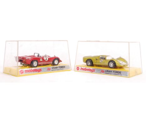 Two Mattel made Mebetoys Gran Toros 1/43 scale precision diecast model sports cars to include; Porsche Carrera 10 and Alfa Ro