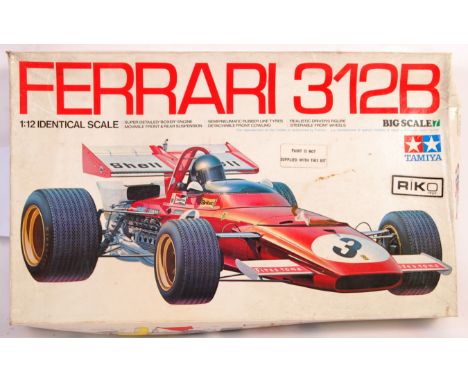 A Tamiya made 1/12 model construction racing car kit ' Ferrari 312B '. Appears complete and not started, but some parts remov
