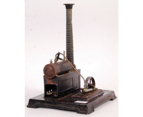 An early 20th Century Gebruder Bing German made tinplate live steam stationary engine raised on metal base with embossed make