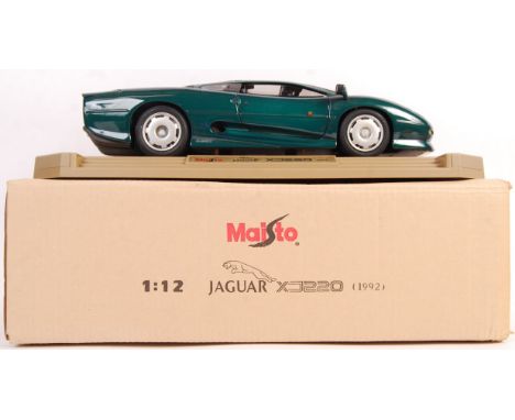 A rare original Maisto 1/12 scale diecast model ' Jaguar XJ220 ' Appears mint and complete within the original postal box. Hi