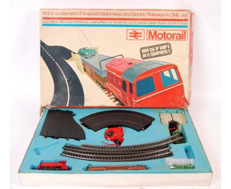 An original vintage Tri-ang / Triang Hornby Minic ' Motorail ' playset. Appears complete (but is unchecked) including the car