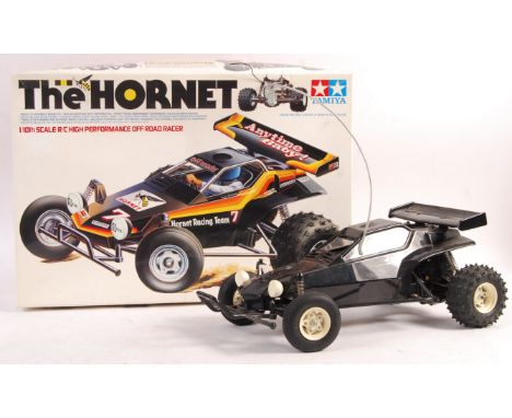 A rare original vintage Tamiya made 1/10 scale radio controlled car ' The Hornet '. Appears complete, including all radio gea