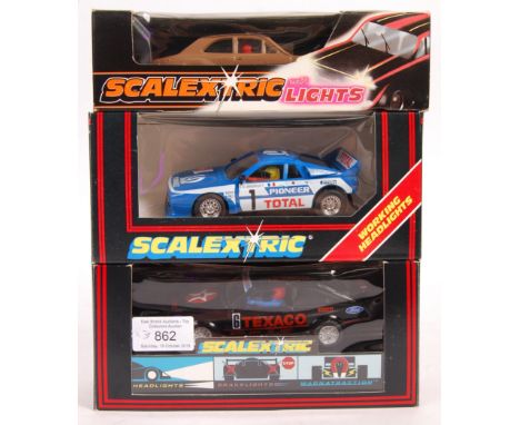 A collection of 3x original vintage Scalextric 1/32 scale slot car racing models all having working headlights / lights compr