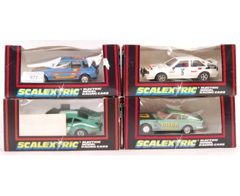 A collection of 4x original vintage Scalextric 1/32 scale slot car racing models comprising: c310 Maestro, C295 Porsche Turbo