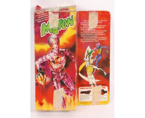 A rare vintage Mego made Denys Fisher issued ' Muton ' boxed action figure. Figure presented within its original box (some we