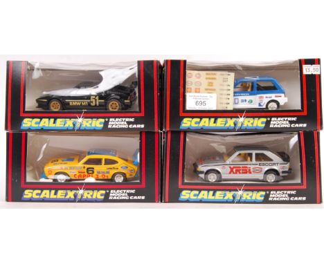 A collection of 4x original vintage Scalextric 1/32 scale slot car racing models comprising: C149 Computervision Metro 6R4, C