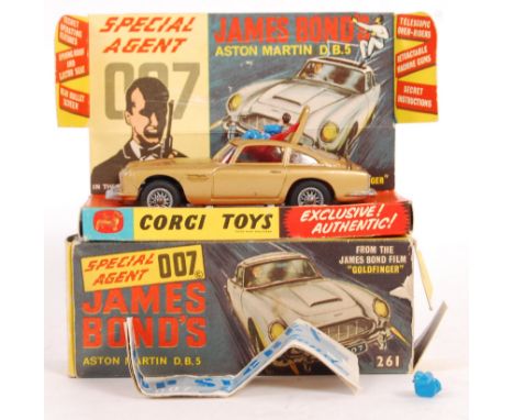 An original vintage Corgi Toys diecast model No. 261 ' James Bond 007 Aston Martin DB5 .' In gold, with silver spoked wheels.