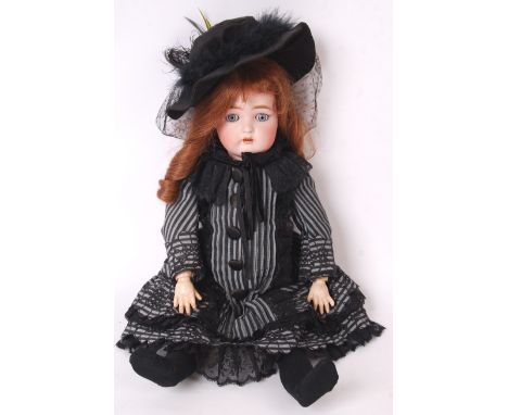 A rare antique late 19th / early 20th century Kammer &amp; Reinhardt Simon &amp; Halbig bisque headed doll. The rear of the h