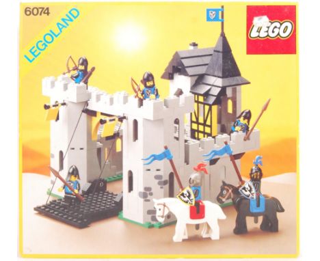 An original vintage 1980's (1986) boxed Lego Legoland set No. 6074 ' Black Falcon Fortress '. Vendor assures us set is 100% c