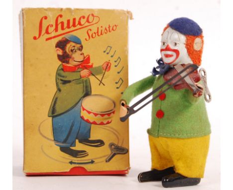 A rare antique vintage 1930's pre-war German Schuco made clockwork tinplate toy ' Clown With Violin '. Felt clothes, with tin