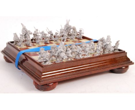 An unusual lead model Japanese Samurai Edo period&nbsp;stylised figure chess set with 10x paints and chess board. Appears com