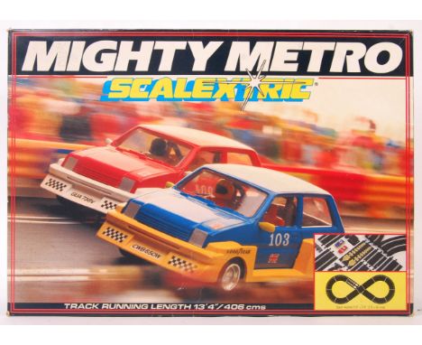 An original vintage Scalextric 1/32 scale slot car racing set ' Mighty Metro '. Appears complete and in good condition within