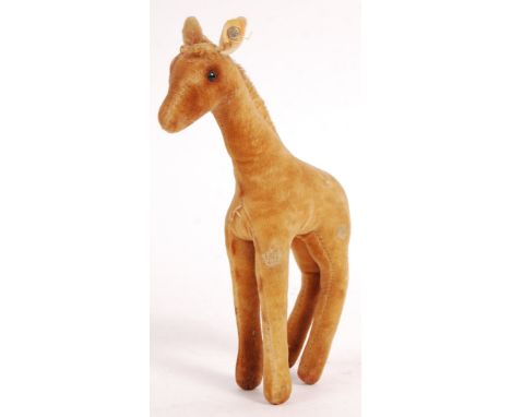 A charming vintage 1950's Steiff made stuffed toy animal Giraffe or Baby Giraffe. Original 1950's Steiff button to ear presen