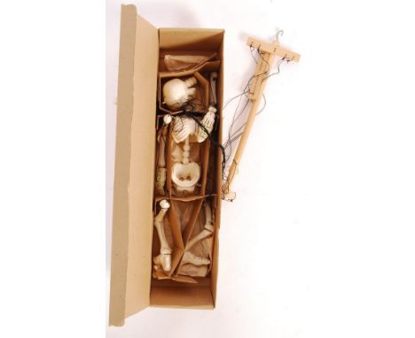 An original vintage Pelham Puppets made SL18 Skeleton puppet. Appears complete with hand, feet and rod in the original earlie