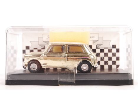 A rare MRRC Jersey made 1/32 scale slot car racing model 30 Years Of Mini Production. The gold plated / coloured model limite