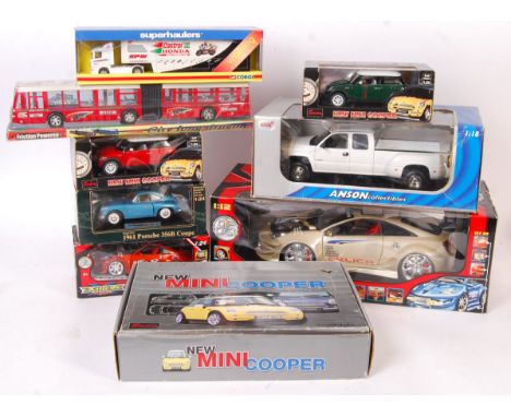 A collection of assorted larger scale boxed diecast models - to include; a 1/12 scale ' Extreme Tuner ' car, various 1/24 sca