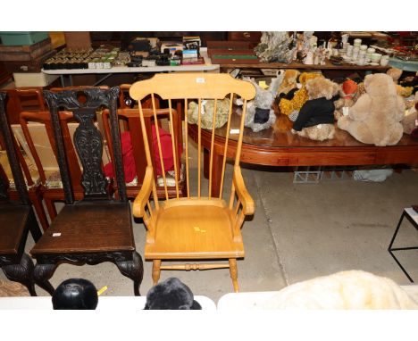 A light wood stick back rocking chair 