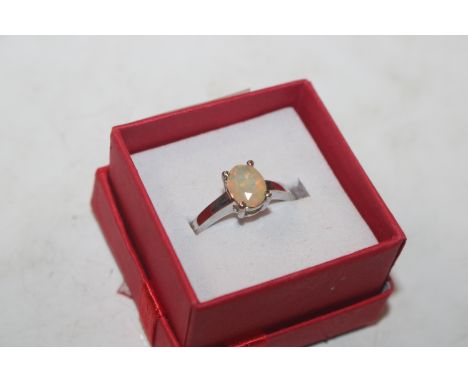 A Sterling silver ring set with solitaire opal, ring size T/U