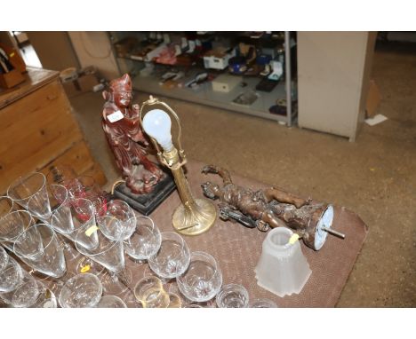 A carved hardwood sage table lamp AF; a spelter figure AF and an Art Deco style table lamp