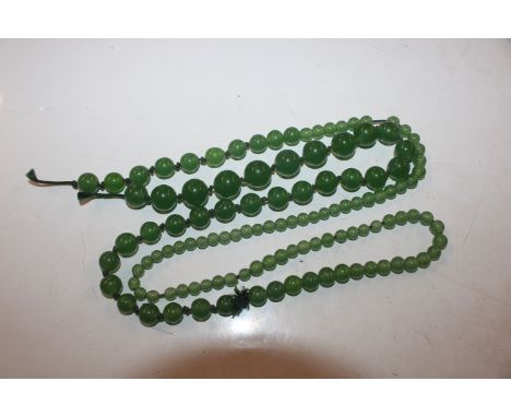 A string of jade coloured hardstone beads 