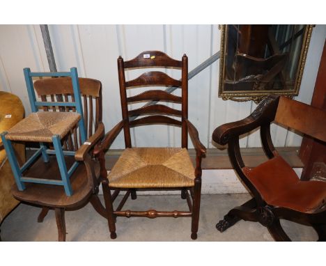 An antique elm rush seat and ladder back elbow chair 